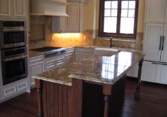 Kitchen with marble panel and center island